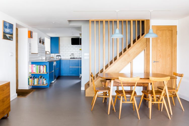 Blue modern kitchen with Scandi style living room