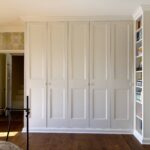 Traditional fitted wardrobe in bedroom