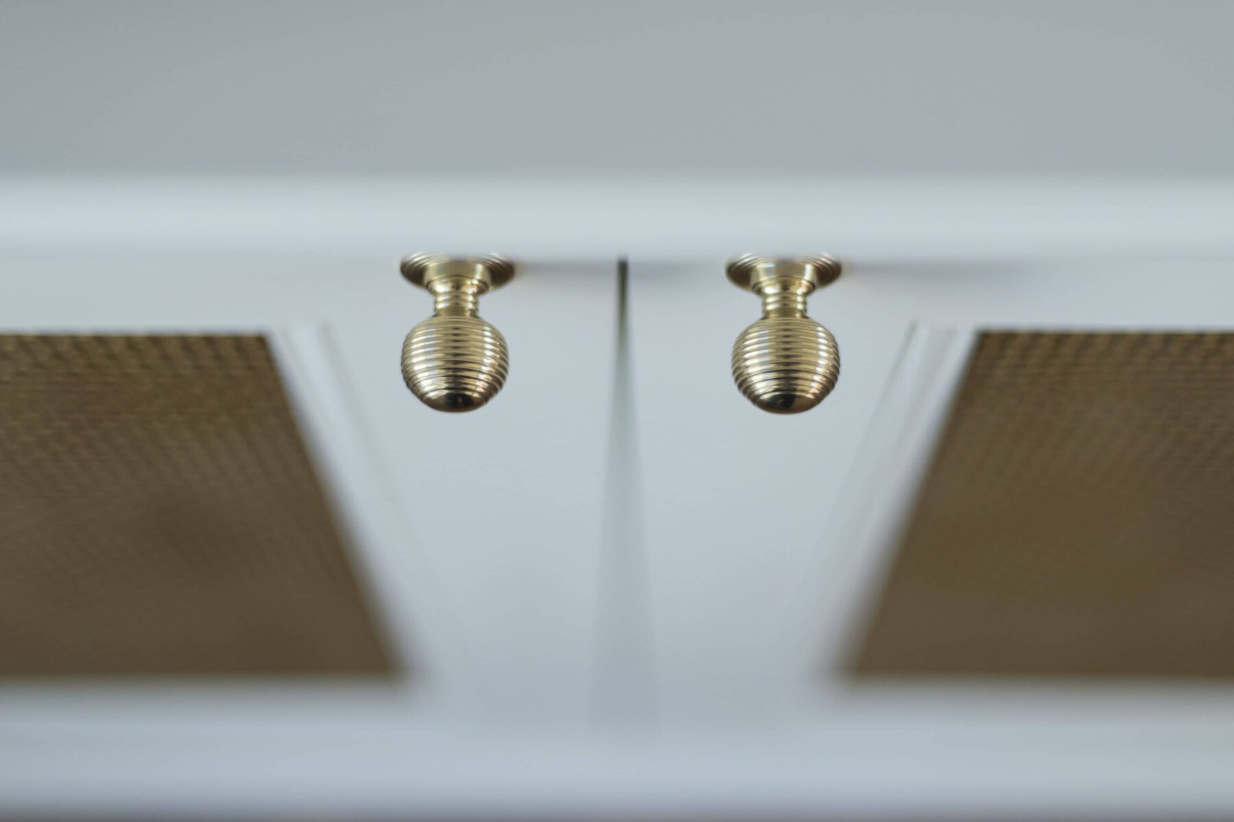 White cabinets with gold knob handles
