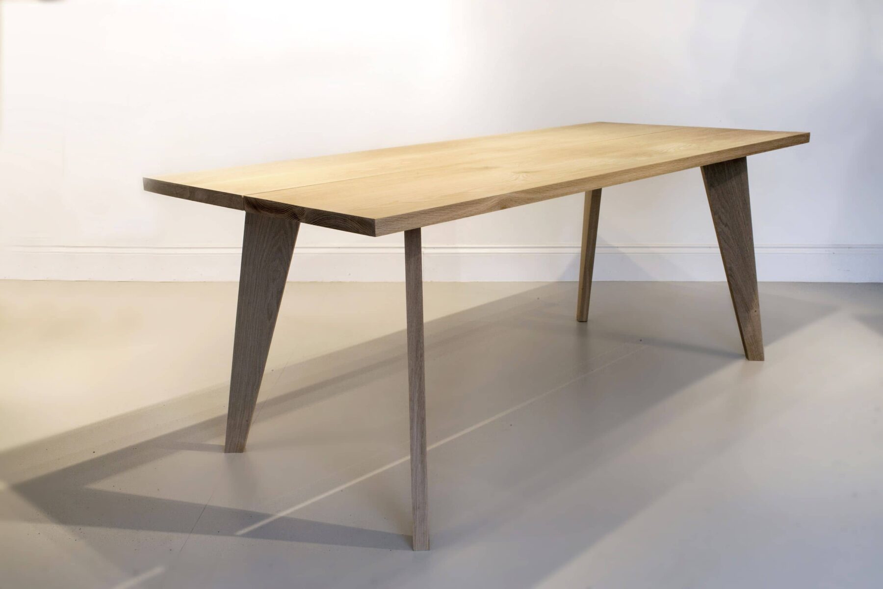 Wooden dining table with tapered legs