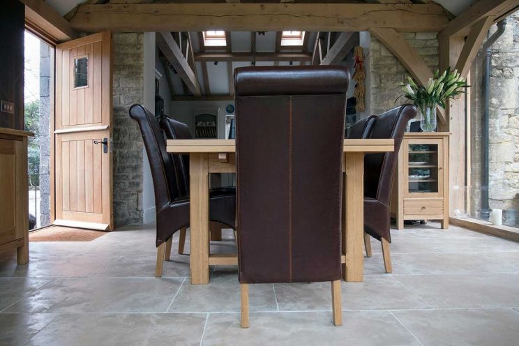 Modern dining room with leather chairs and oak dining table