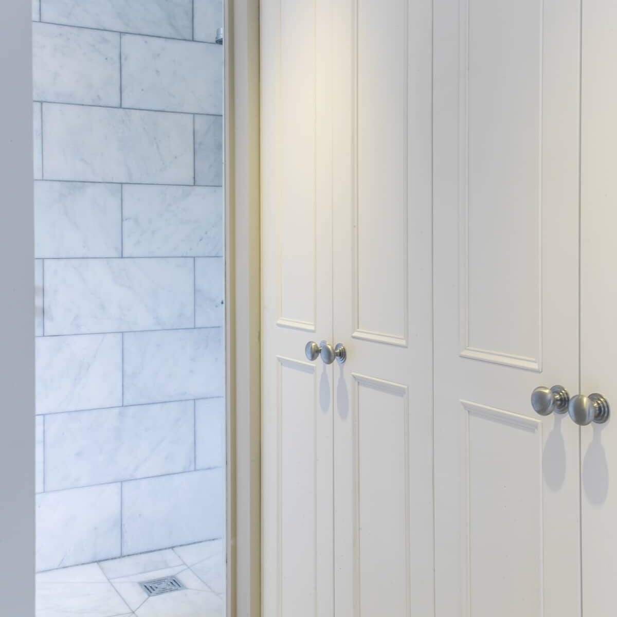 Fitted storage solutions in a contemporary bathroom.