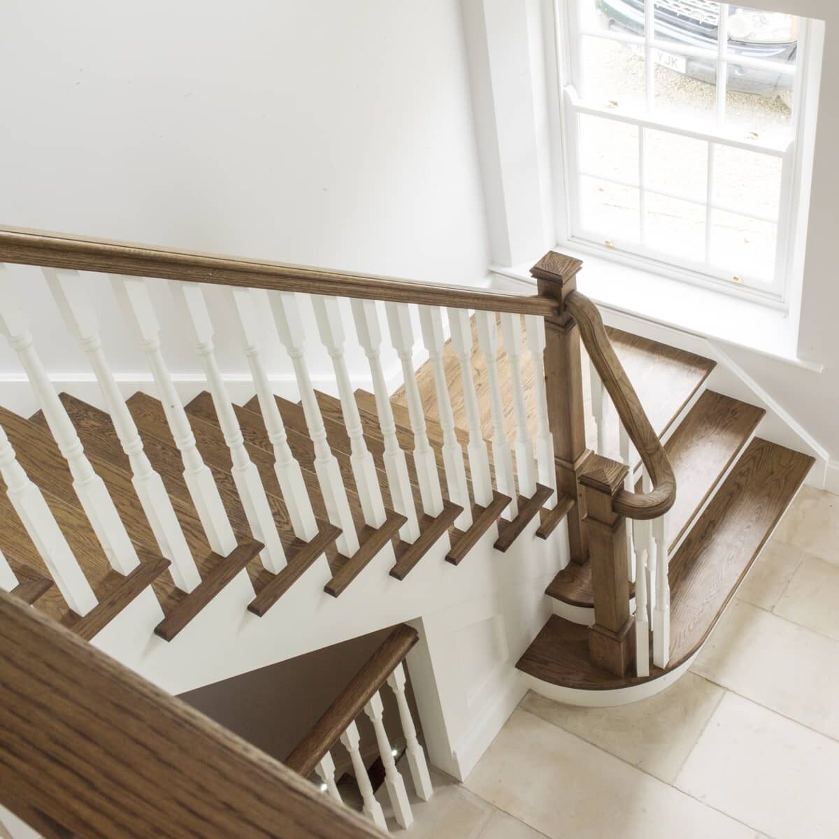 Curved oak staircase with banisters