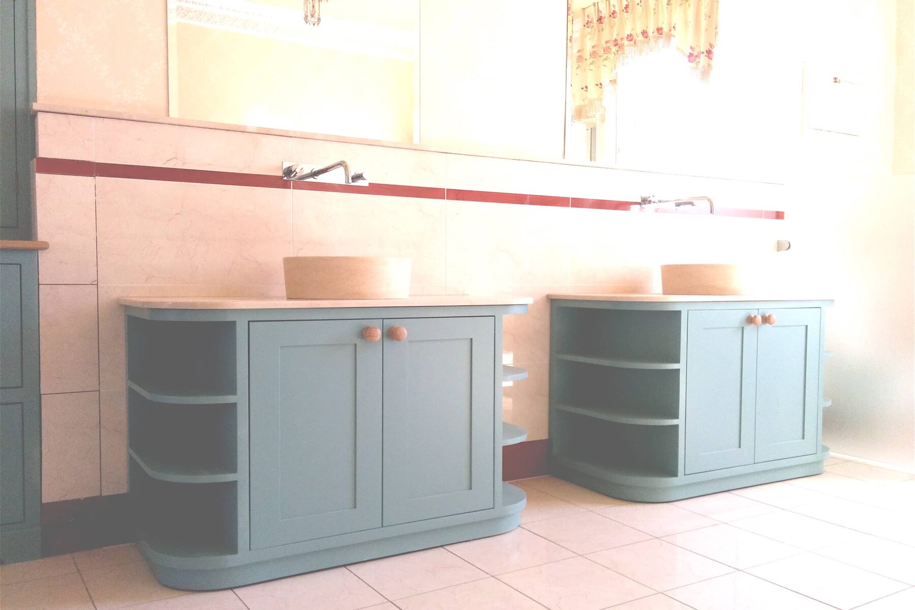 Green curved bathroom cabinets