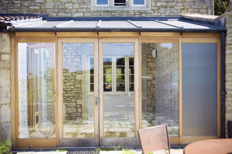 Oak conservatory extension with a lead roof near Box, Bath