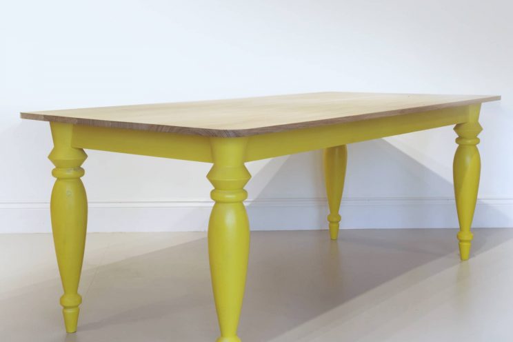 Contemporary wooden kitchen table with yellow legs