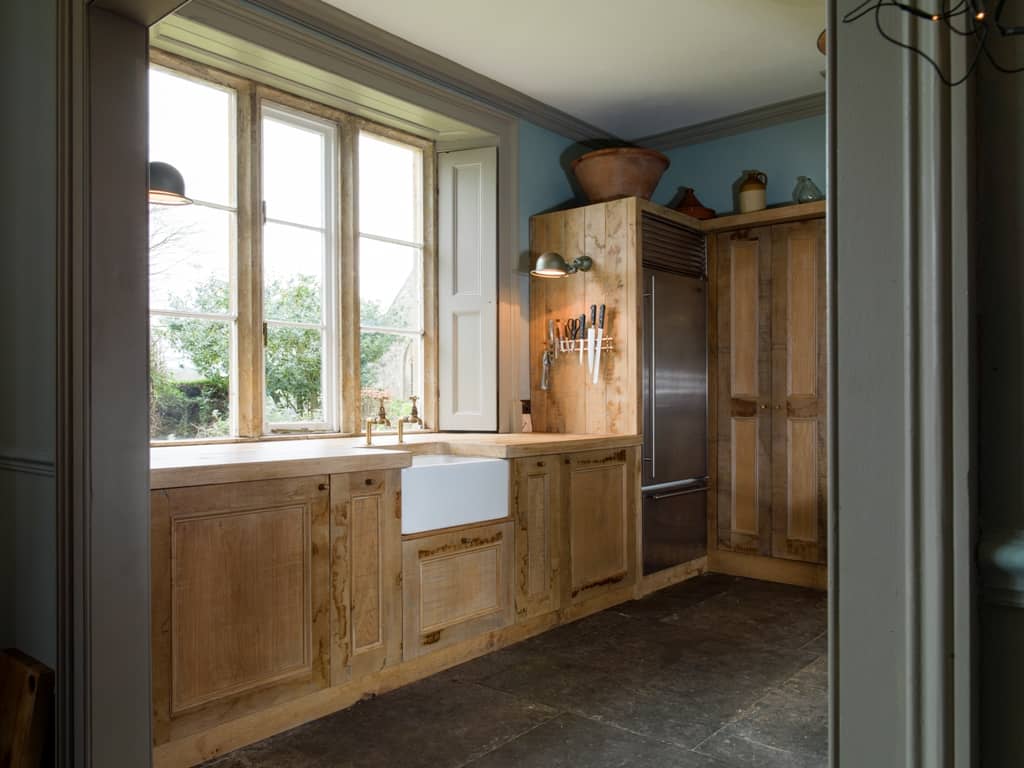 Rustic sustainable kitchen cabinets designed by Mia Marquez