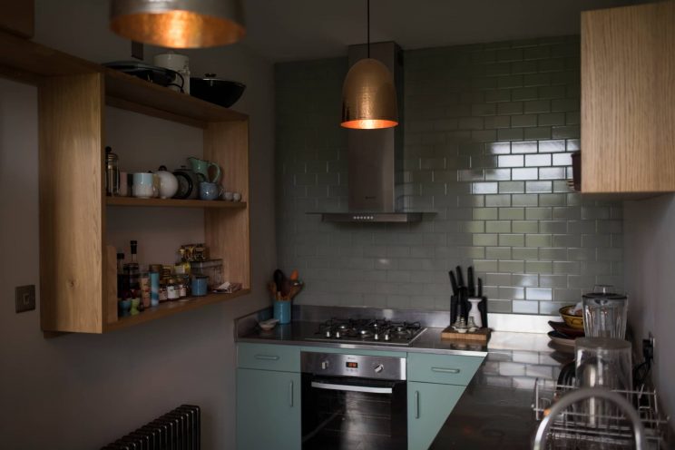 Copper lighting and shelving detail from a handmade contemporary kitchens by Bath Bespoke