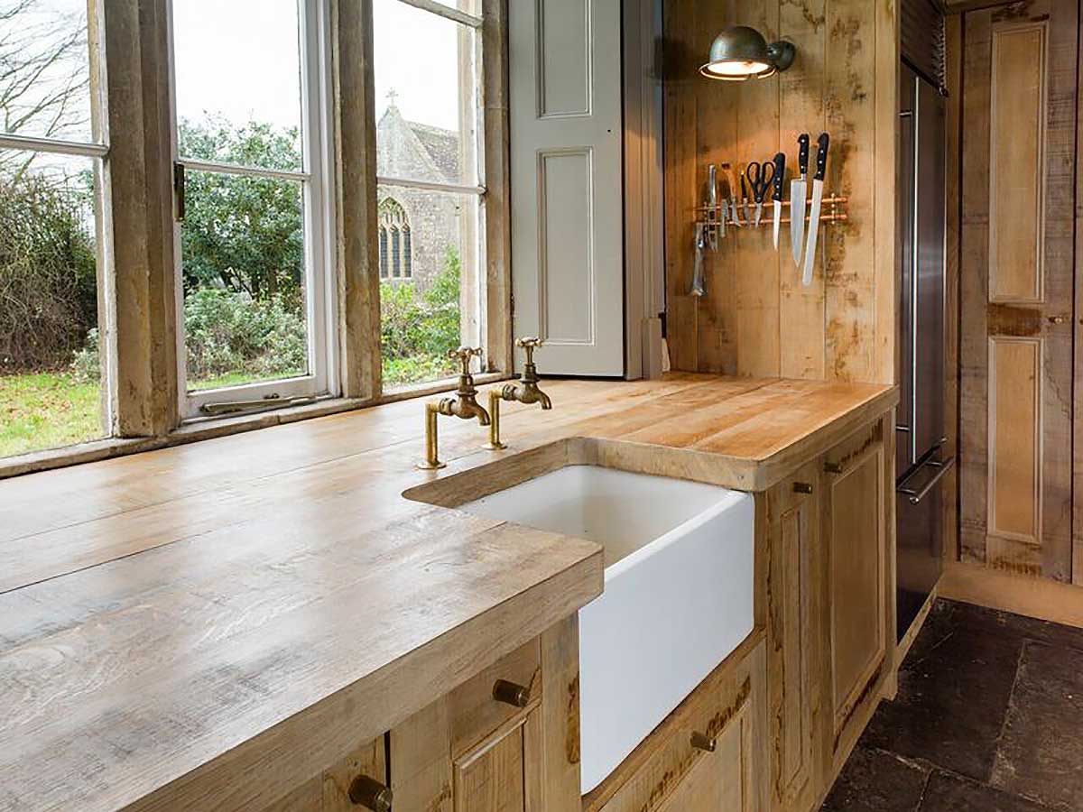 Rustic wood kitchen with white basin sink