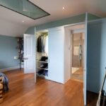 Fitted wooden wardrobe in bedroom
