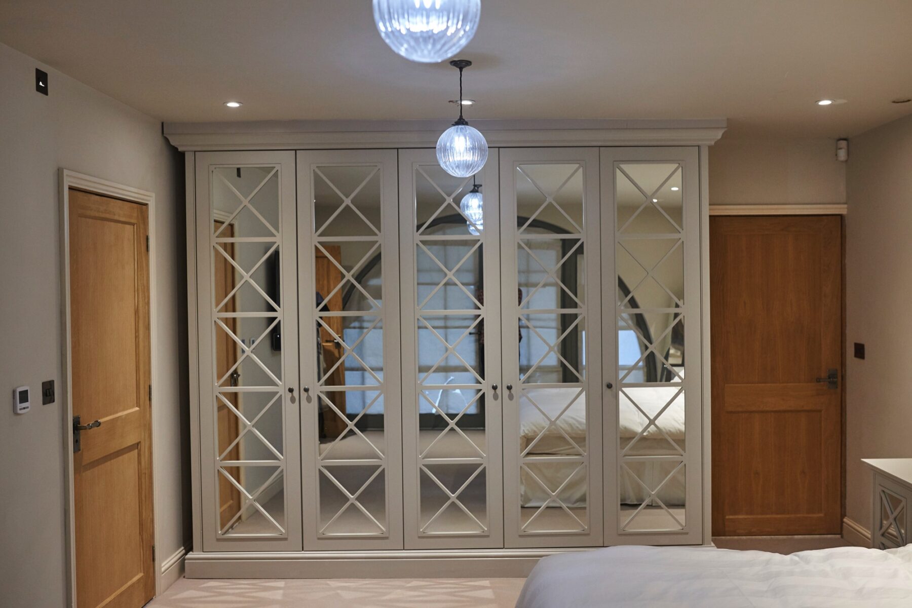 Art Deco wardrobe with mirror doors in bedroom