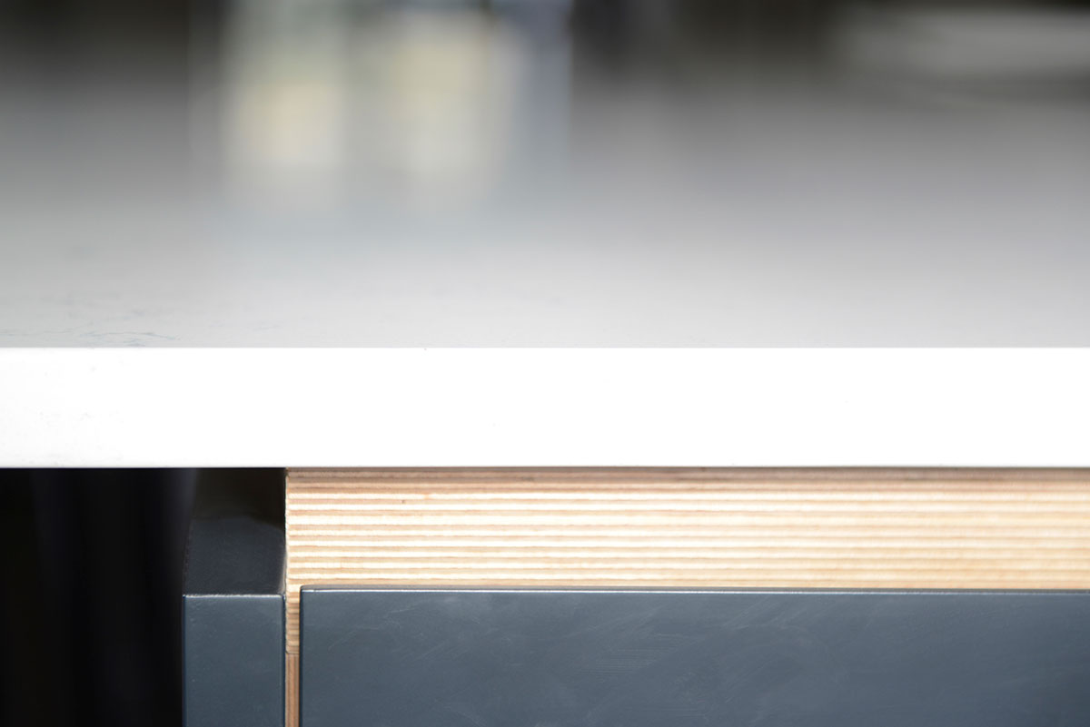 Modern dark grey kitchen with Snowy Ibiza Silestone kitchen counter top