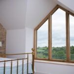 Oak apex window in a master bedroom in Bath