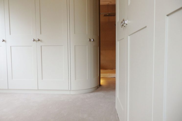 Curved wardrobes in bedroom