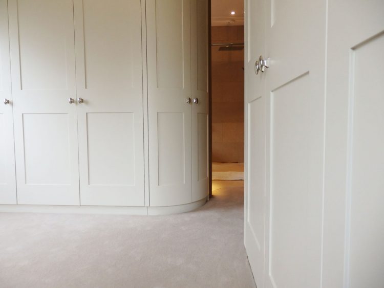 Curved white wardrobes