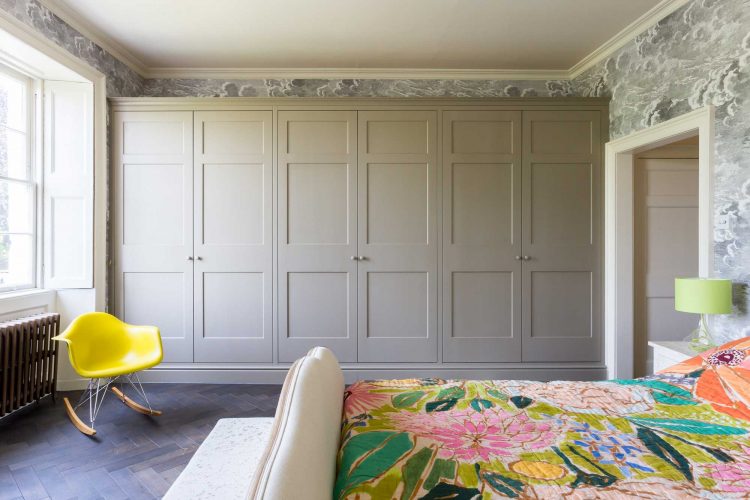 Classic fitted bedroom wardrobe & oak parquet flooring