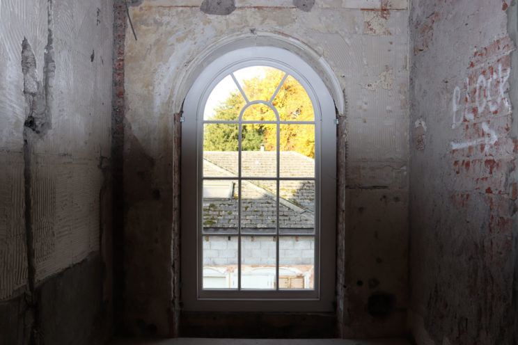 Arched sash window in a Georgian property