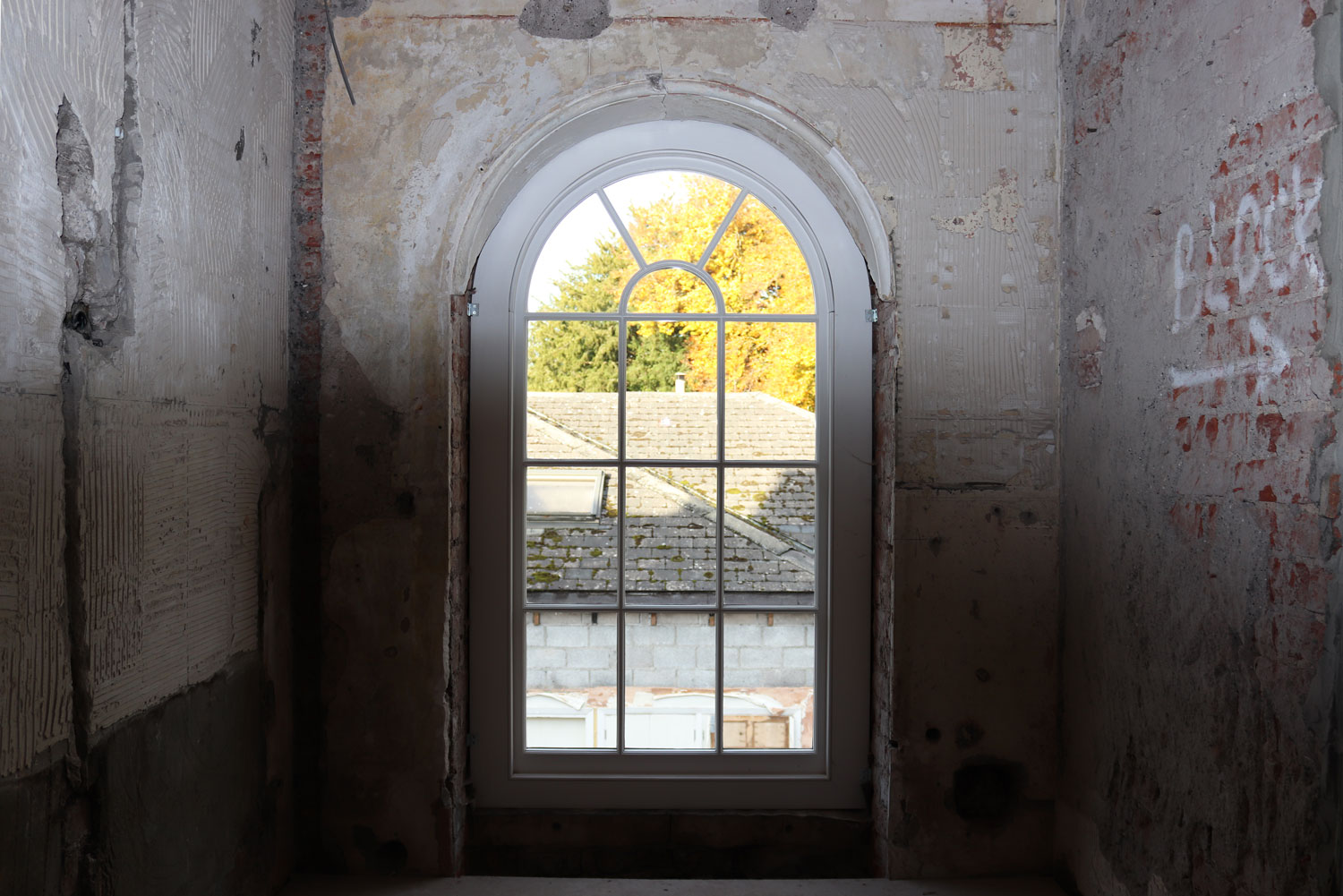 Arched sash window in a Georgian property