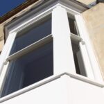 Sash window with acoustic glass