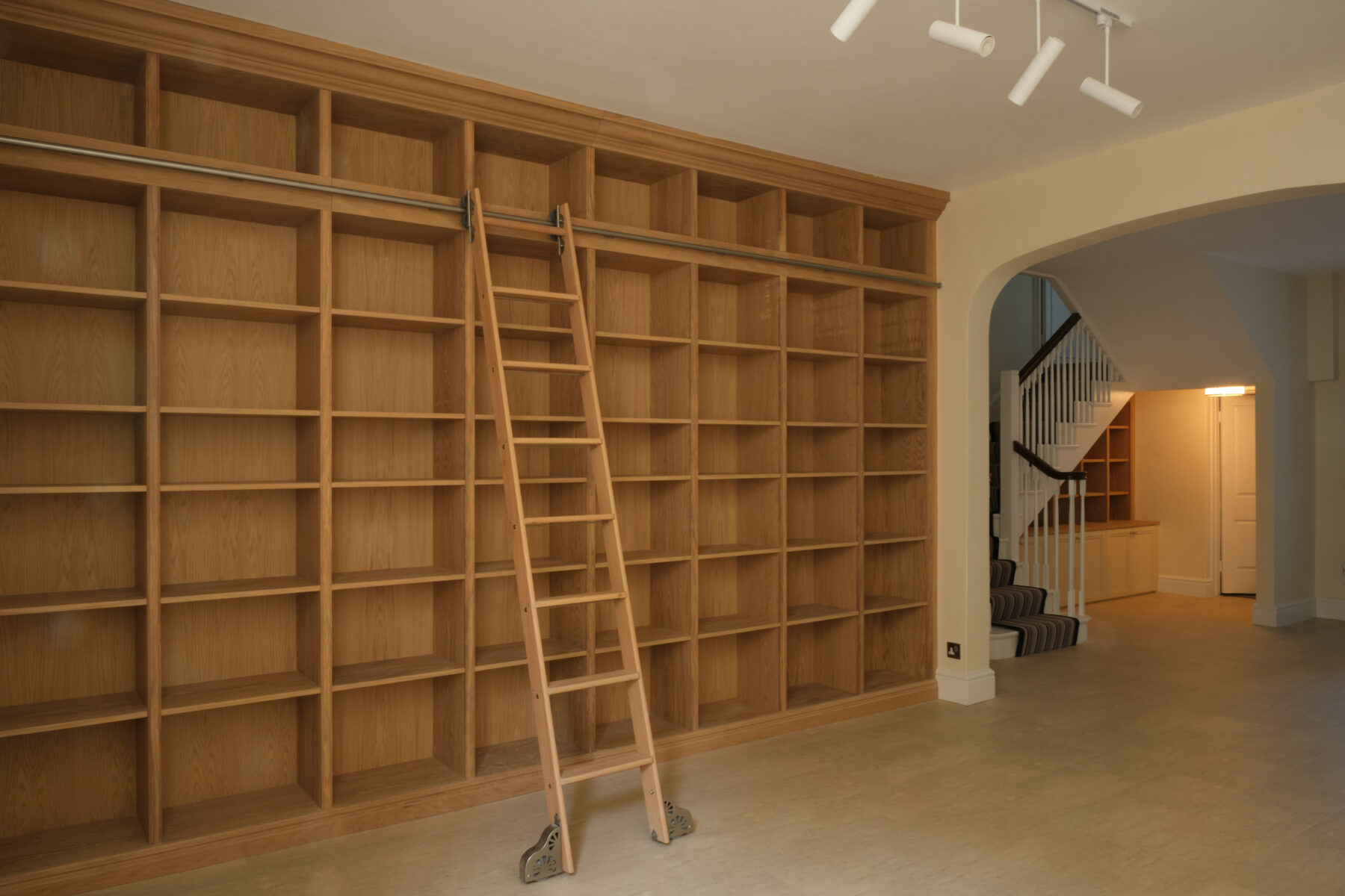 Bespoke library in oak with high-load, gliding ladder